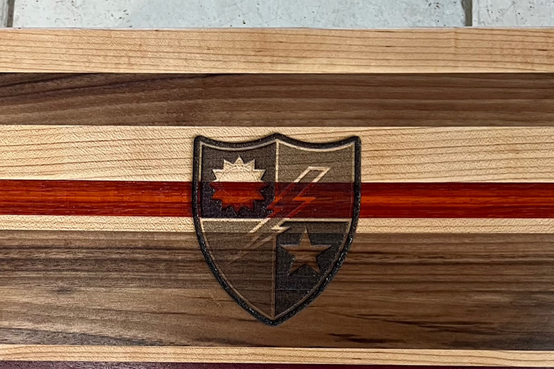 Engraving capabilities, this board was for a retired army ranger and he wanted the badge on it.